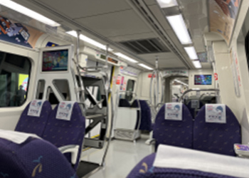 The MRT train is spacious and has luggage racks.